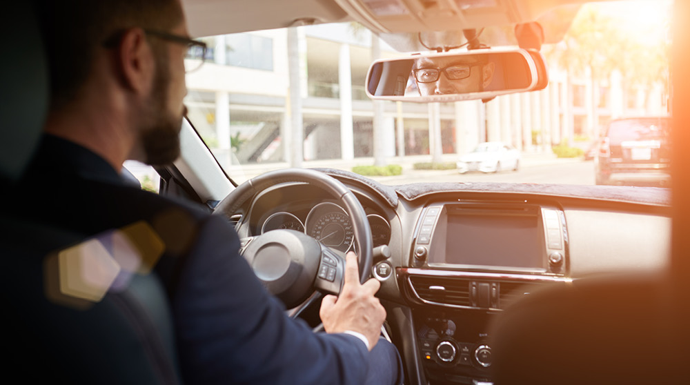 man driving rental car